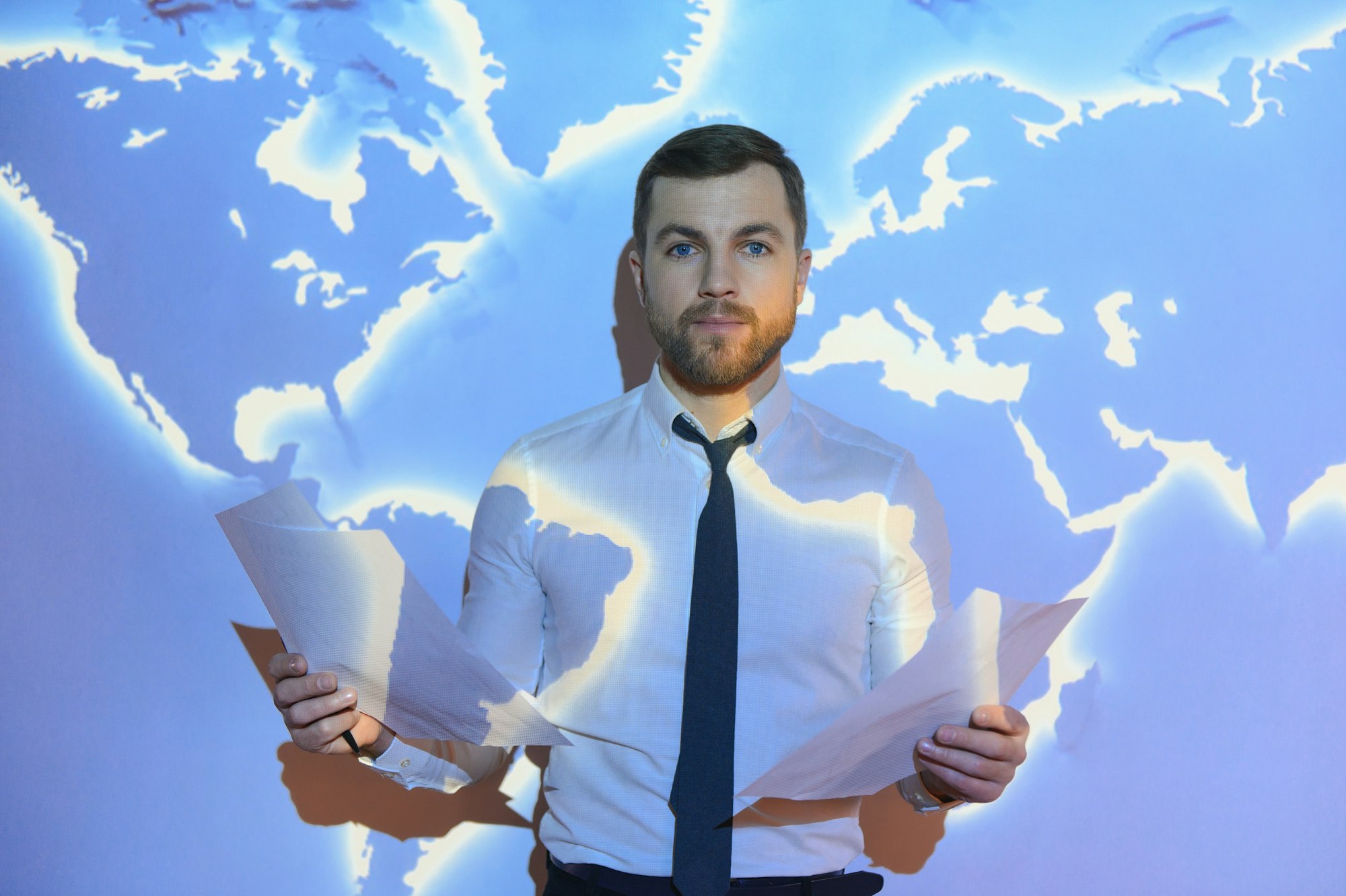 businessman on the background of the world map, international economy.